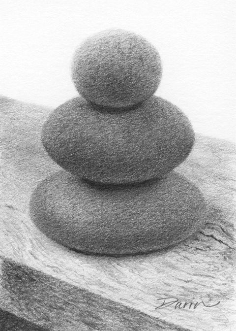 A black and white graphite drawing of three stacked rounded stones, as a cairn, on a wood surface, with a visible artist signature ‘Darin’ near the bottom right.