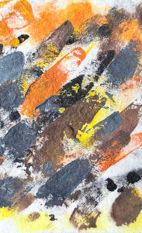 Abstract textured painting with layered brush and palette-knife strokes in orange, yellow, black, gray, and brown on a white background.
