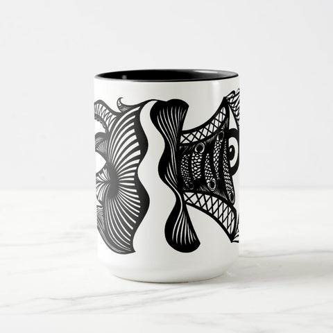 White ceramic coffee mug with a black handle and black interior, featuring a wrap‑around print of the artwork titled “Burnin’ Urchin.“