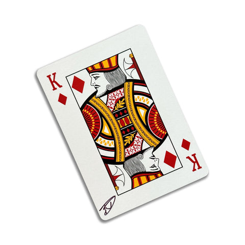 Back of the playing card showing the King of diamonds with a hand‑signed signature ‘DJ’ in black ink.
