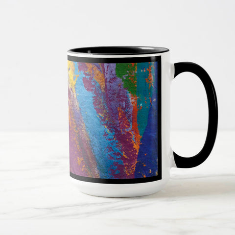 White ceramic coffee mug with a black handle and black interior, featuring a wrap‑around print of the artwork titled “Creative Palette.“