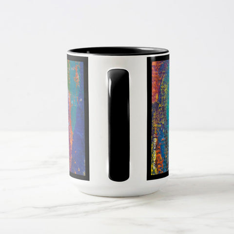 White ceramic coffee mug with a black handle and black interior, featuring a wrap‑around print of the artwork titled “Creative Palette.“