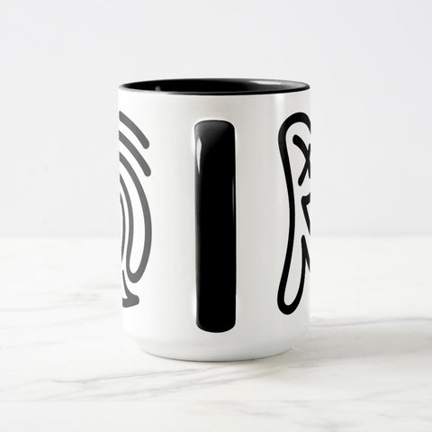 White ceramic coffee mug with a black handle and black interior, featuring a wrap‑around print of the Obscuratype™ artwork titled ‘Keith Haring.’