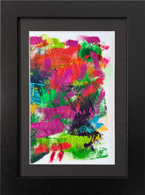 Abstract textured painting with layered brush and palette-knife strokes in pink, green, red, blue, yellow, and purple on a white background; matted and framed in black.