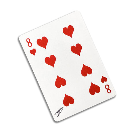 Back of the playing card showing the 8 of hearts with a hand‑signed signature ‘DJ’ in black ink.