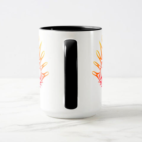 White ceramic coffee mug with a black handle and black interior, featuring a mirrored colorful gradient print of the artwork titled “Pinned.“