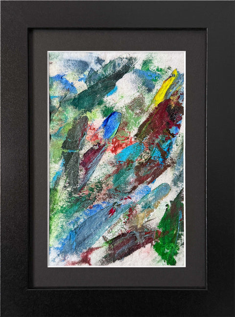 Abstract textured painting with layered brush and palette-knife strokes in blue, green, gray, brown, yellow, and red; matted and framed in black.