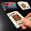 Back of the playing card showing the Jack of clubs with a hand‑signed signature ‘DJ’ in black ink.