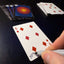Back of the playing card showing the 6 of diamonds with a hand‑signed signature ‘DJ’ in black ink.