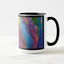 White ceramic coffee mug with a black handle and black interior, featuring a wrap‑around print of the artwork titled “Creative Palette.“