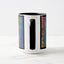White ceramic coffee mug with a black handle and black interior, featuring a wrap‑around print of the artwork titled “Creative Palette.“