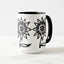 White ceramic coffee mug with a black handle and black interior, featuring a wrap‑around print of the artwork titled “Flowerize.“