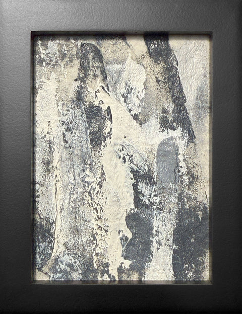 Abstract textured painting with layered brush and palette-knife strokes in shades of gray and white on a white background; framed in black.