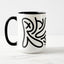 White ceramic coffee mug with a black handle and black interior, featuring a wrap‑around print of the Obscuratype™ artwork titled ‘Keith Haring.’