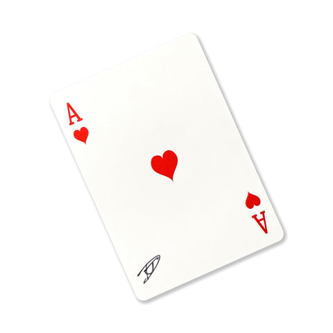 Back of the playing card showing the Ace of hearts with a hand‑signed signature ‘DJ’ in black ink.