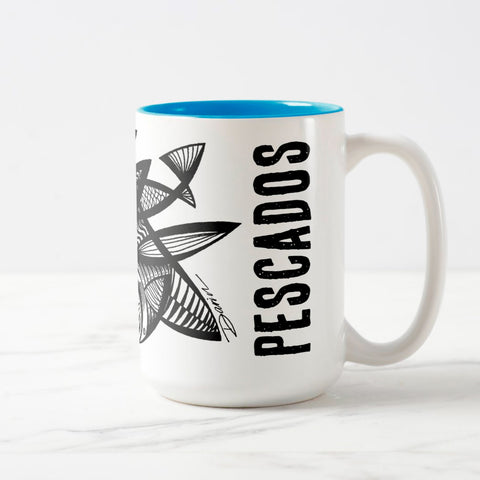White ceramic coffee mug with a white handle and blue interior, featuring a wrap‑around print of the artwork titled “Pescados.“