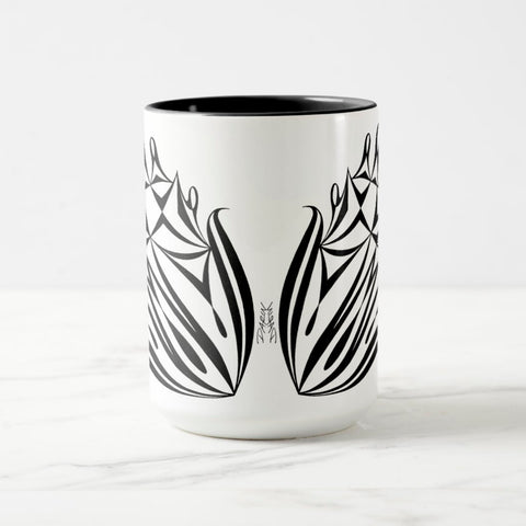 White ceramic coffee mug with a black handle and black interior, featuring a mirrored black and white print of the artwork titled “Pinned.“
