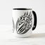 White ceramic coffee mug with a black handle and black interior, featuring a mirrored black and white print of the artwork titled “Pinned.“
