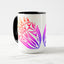 White ceramic coffee mug with a black handle and black interior, featuring a mirrored colorful gradient print of the artwork titled “Pinned.“