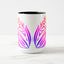White ceramic coffee mug with a black handle and black interior, featuring a mirrored colorful gradient print of the artwork titled “Pinned.“