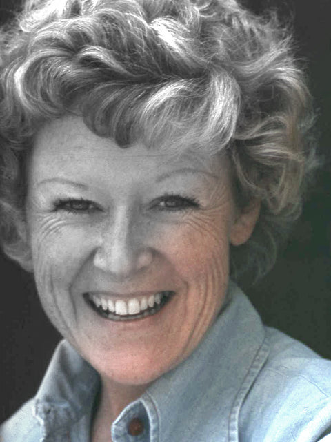 Photograph of a smiling female with a gradient of black-and-white in the upper-left corner and transitions to color in lower-right corner.