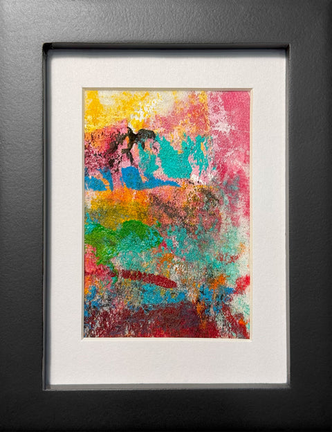 Abstract textured painting with layered brush and palette-knife strokes in pink, turquoise, yellow, orange, green, red, and black; matted in white and framed in black.