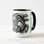 White ceramic coffee mug with a black handle and black interior, featuring a wrap‑around print of the artwork titled “Spiked.“