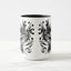 White ceramic coffee mug with a black handle and black interior, featuring a wrap‑around print of the artwork titled “The Factory.“