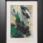 Abstract textured painting with layered brush and palette knife strokes in black, gray, off-white, metallic gold, and green; matted in white and framed in black.